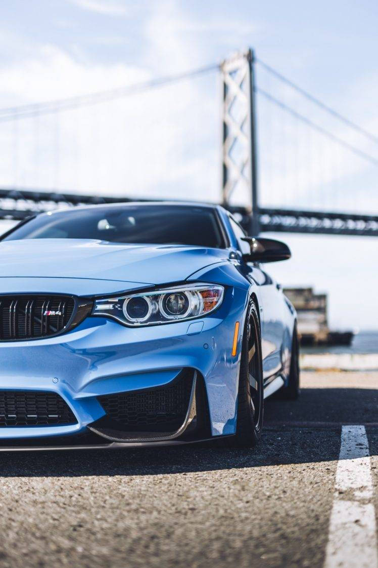 Parked Blue Bmw With Bridge View Wallpaper