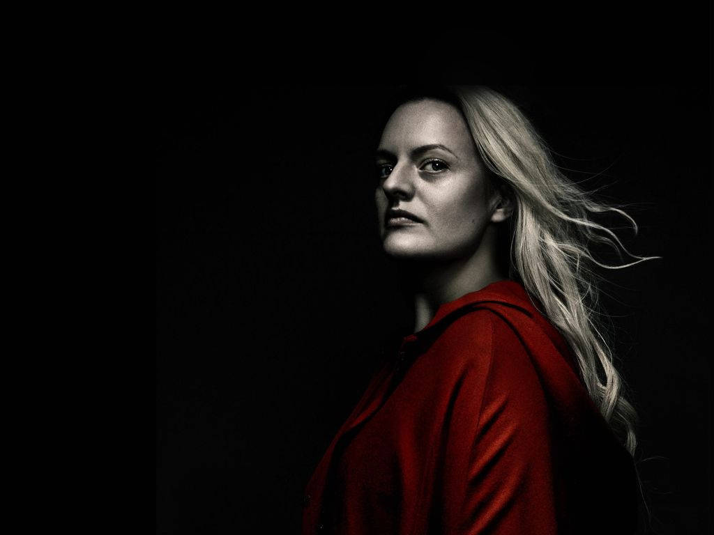 Pensive Elizabeth Moss In The Handmaid's Tale Wallpaper