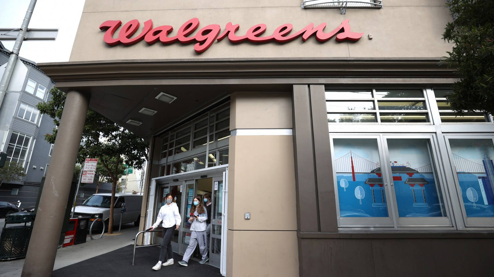 People Exiting Walgreens Store Wallpaper