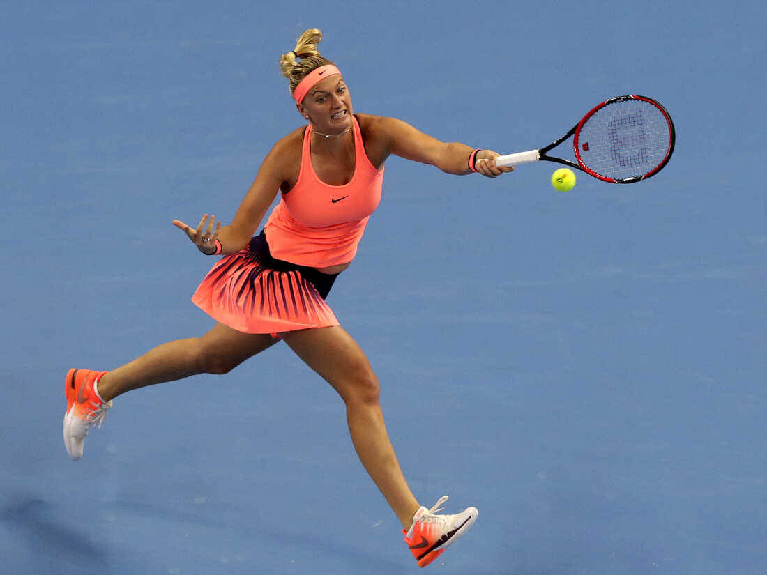 Petra Kvitova Jumping And Hitting Ball Wallpaper