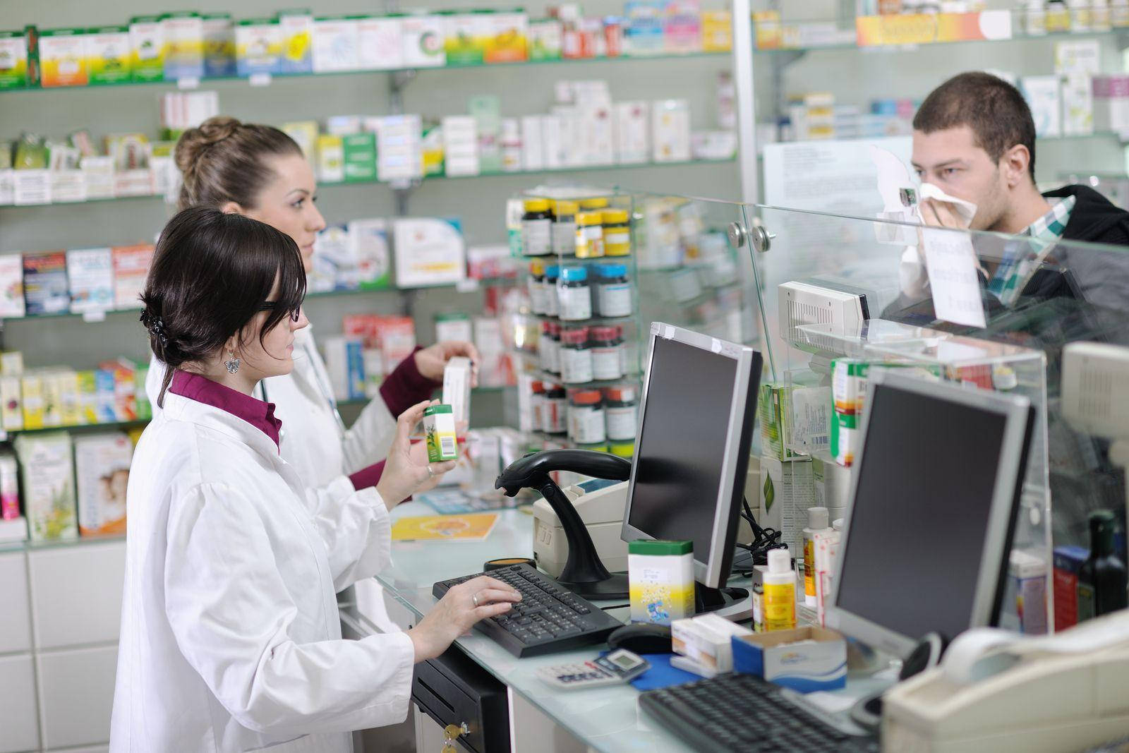 Pharmacists Assisting Guy With Towel On His Nose Wallpaper