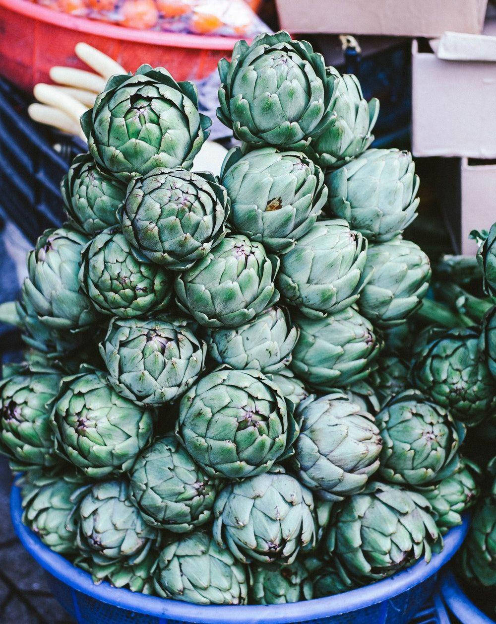 Piles Of Green Artichoke Vegetables Wallpaper