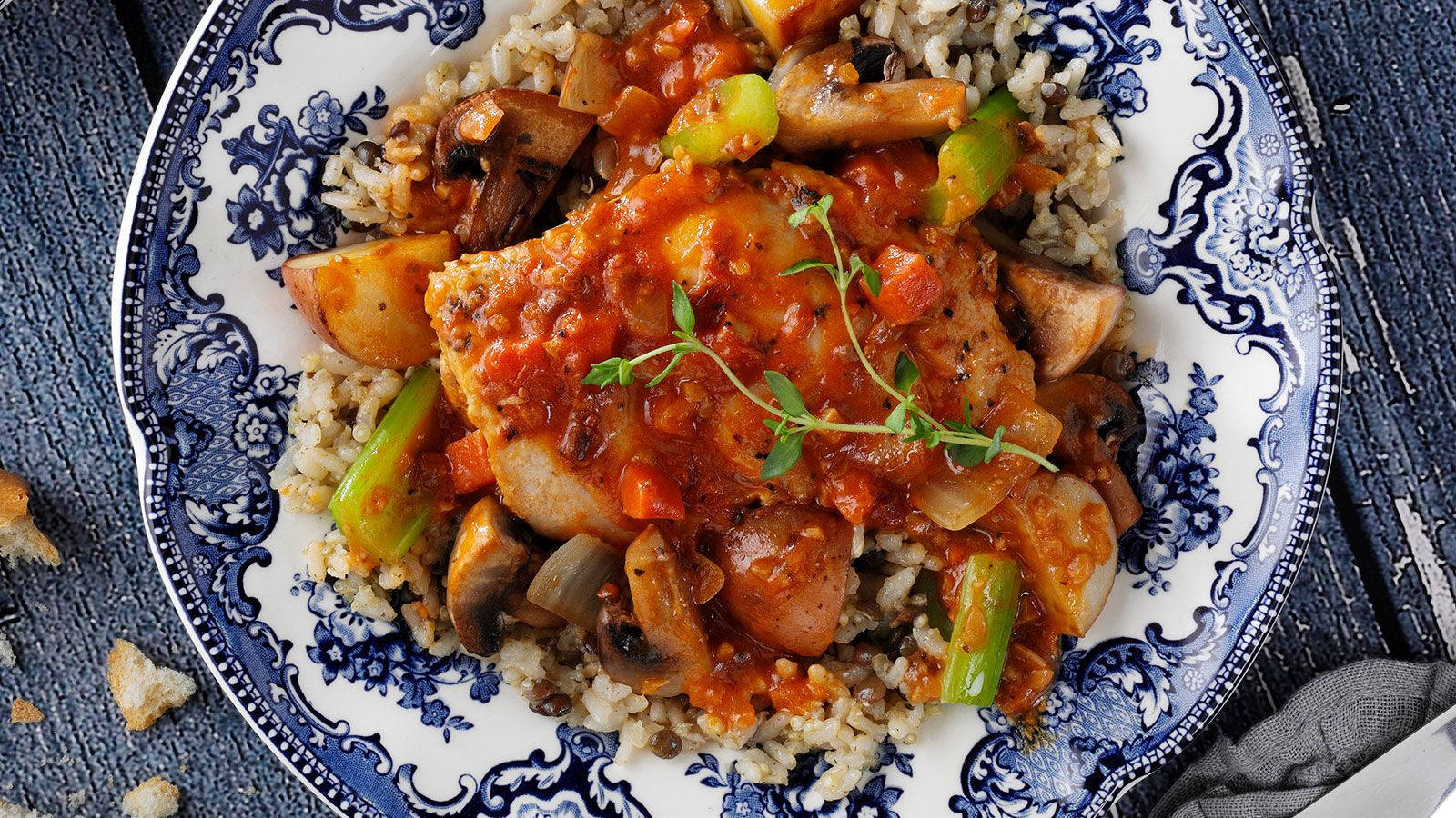 Plate Of Rice Topped With Coq Au Vin Wallpaper