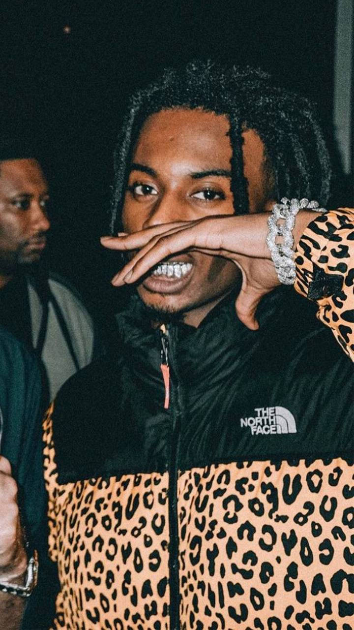 Playboi Carti Poses In A Leopard Graphic Print Wallpaper