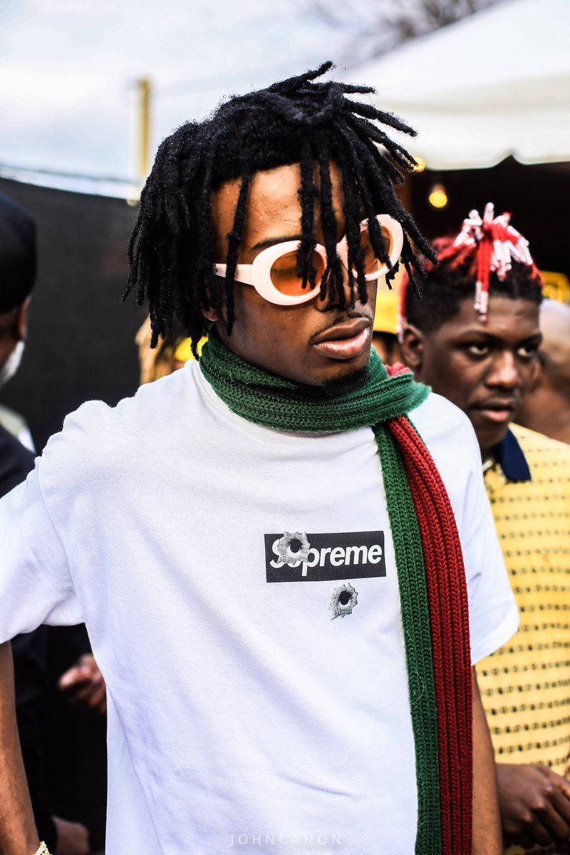 Playboi Carti Styling In His Supreme Shirt Wallpaper