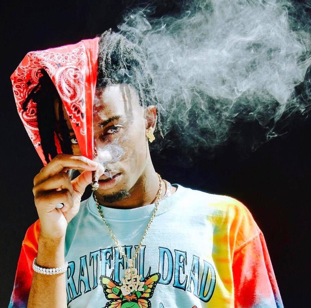 Playboi Carti Wears Classic Red Bandana. Wallpaper