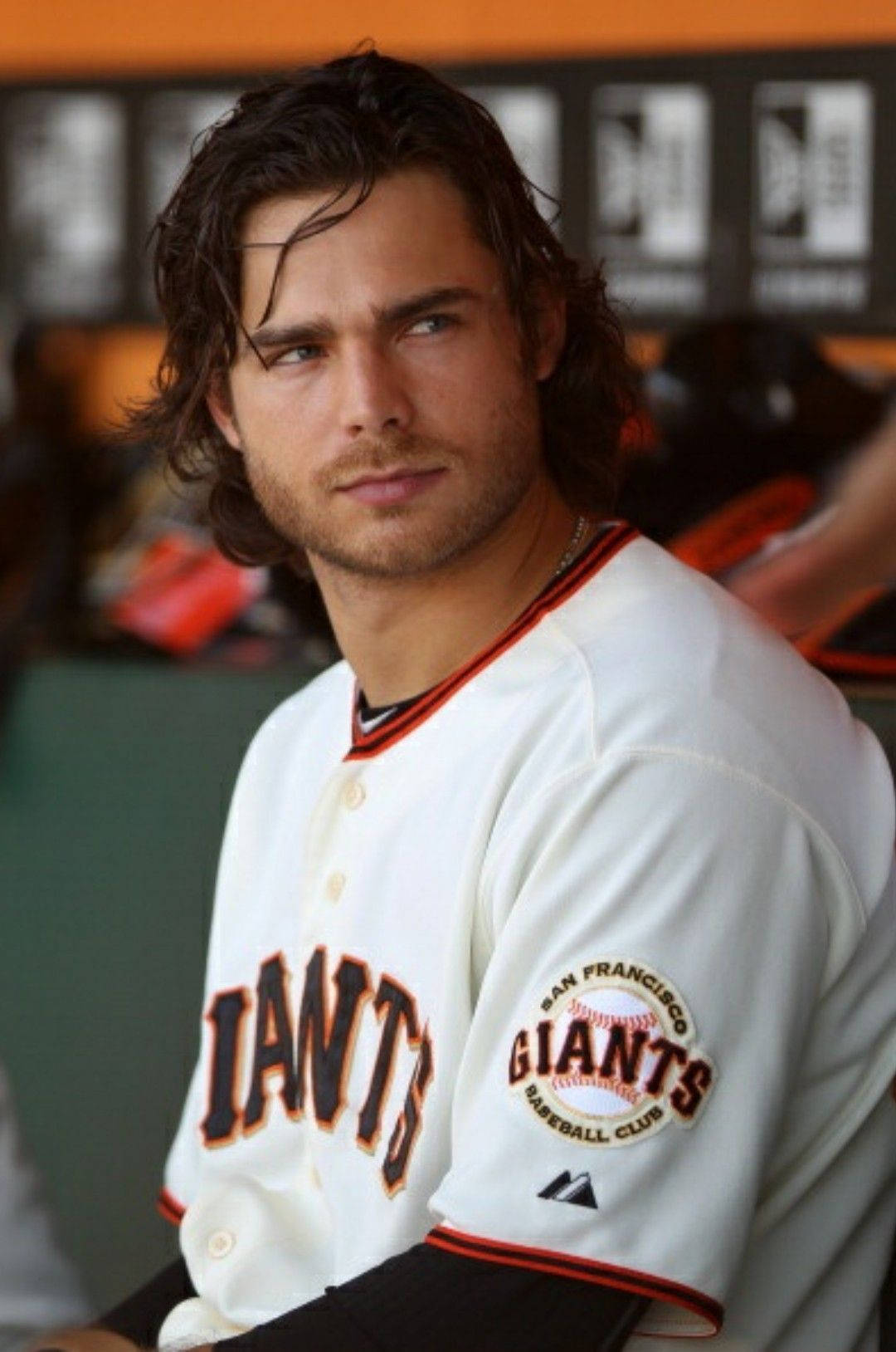 Professional Baseball Star Brandon Crawford With His Iconic Long Hair Wallpaper