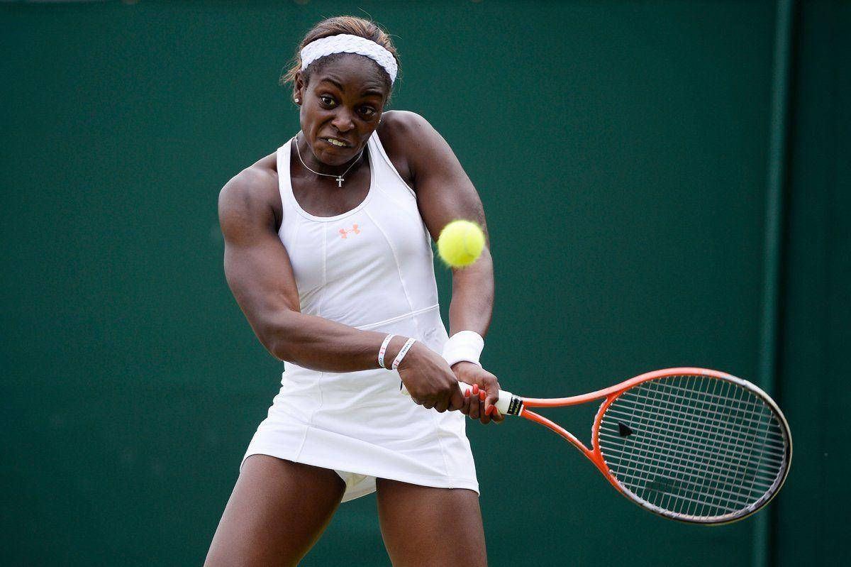 Professional Tennis Player, Sloane Stephens, In Action With Both Hands On Racket Wallpaper