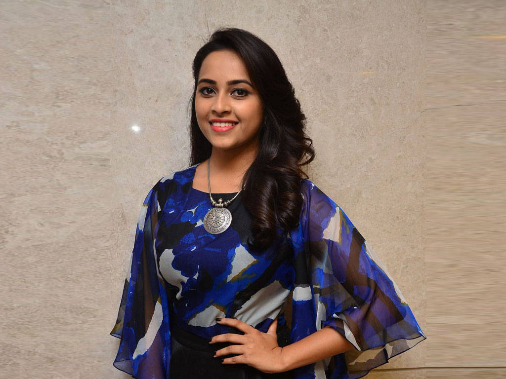 Radiant Sri Divya At A Public Event Wallpaper