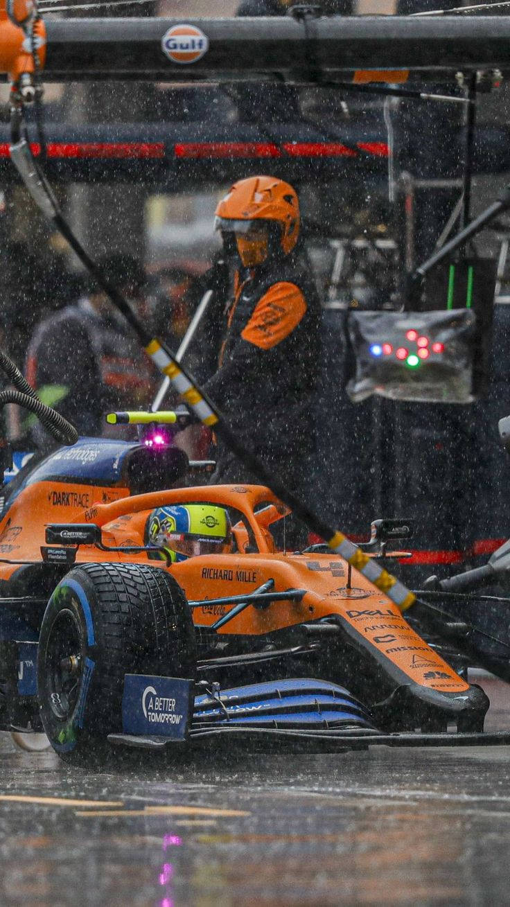 Raining On Lando Norris’ Car Wallpaper