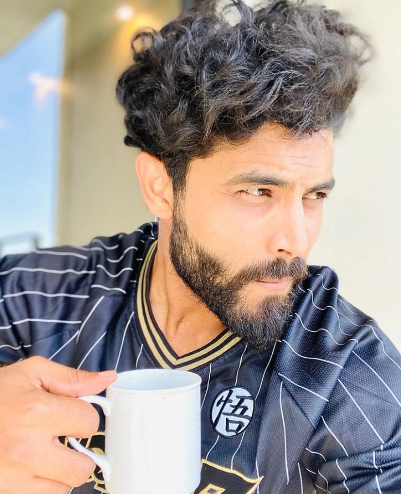 Ravindra Jadeja Holding A Cup Wallpaper