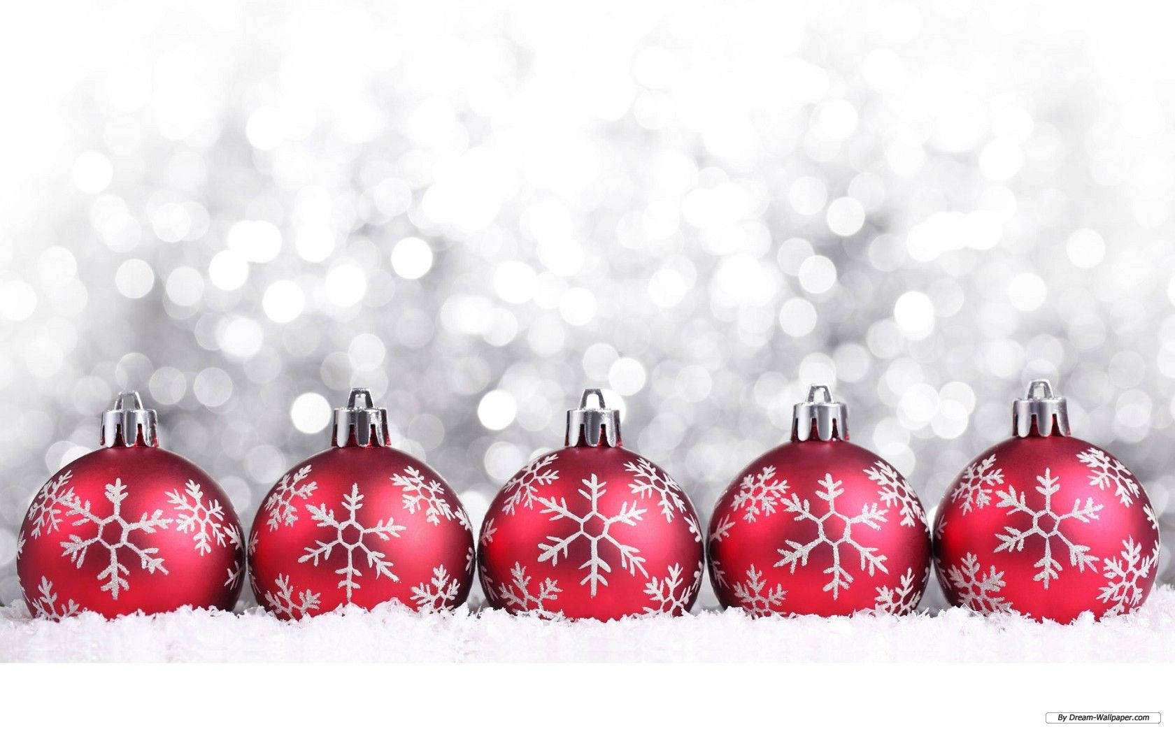 Red Christmas Balls With Snowflakes Laying On Snow Wallpaper