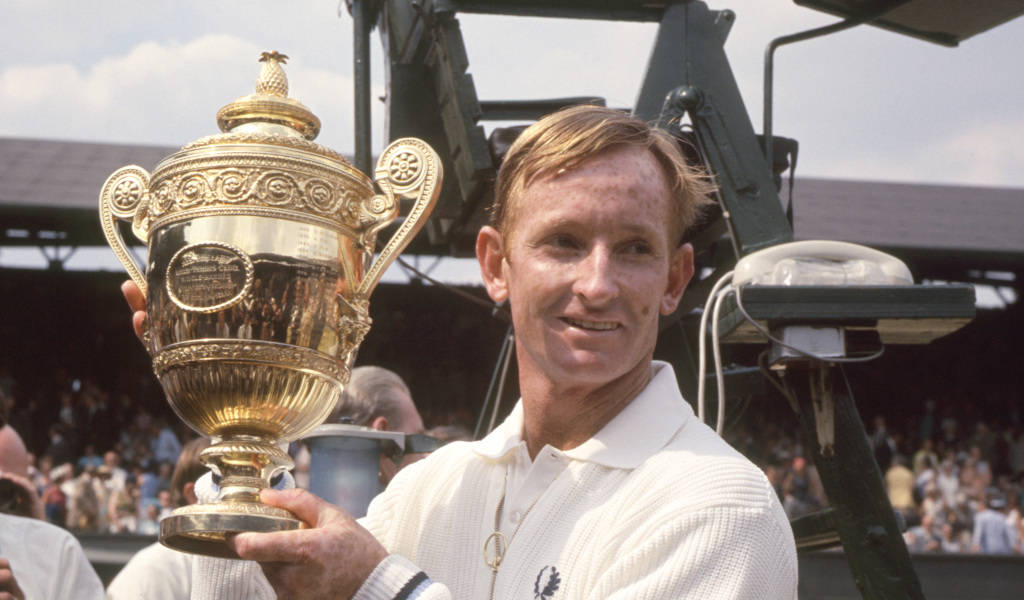 Rod Laver Triumphantly Lifting The Wimbledon Trophy Wallpaper