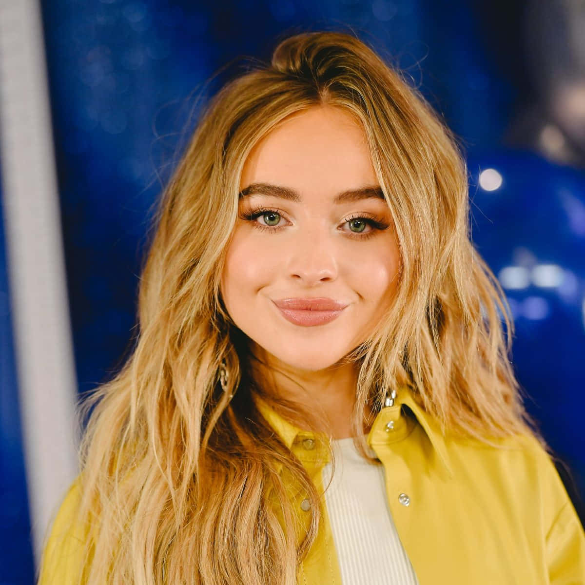 Sabrina Carpenter Yellow Jacket Portrait Wallpaper