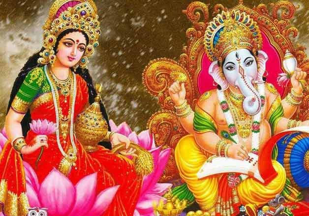 Sacred Aura Of Lord Ganesh And Goddess Lakshmi Wallpaper