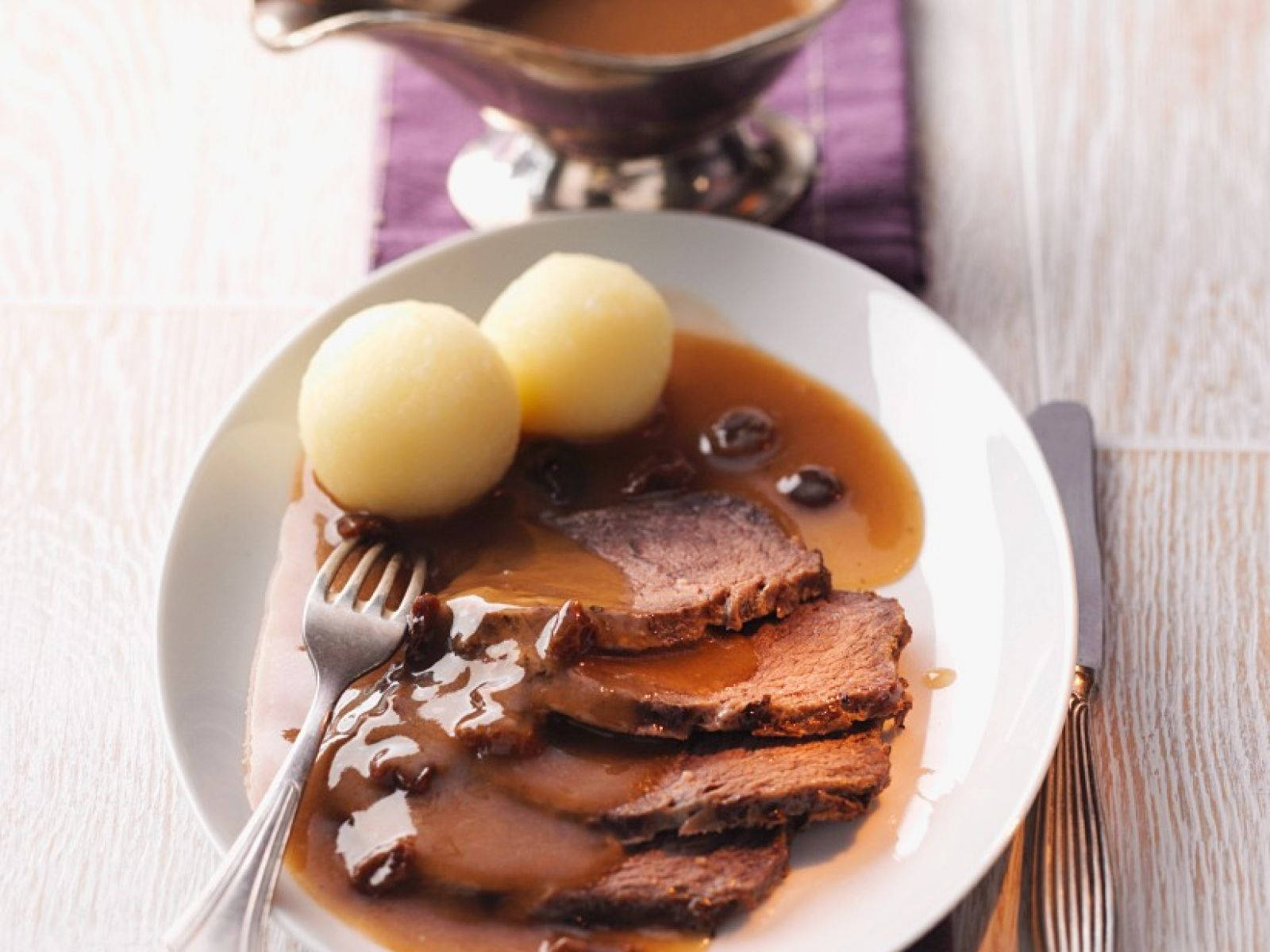 Sauerbraten Traditional German Meal With Round Potato Dumplings Wallpaper