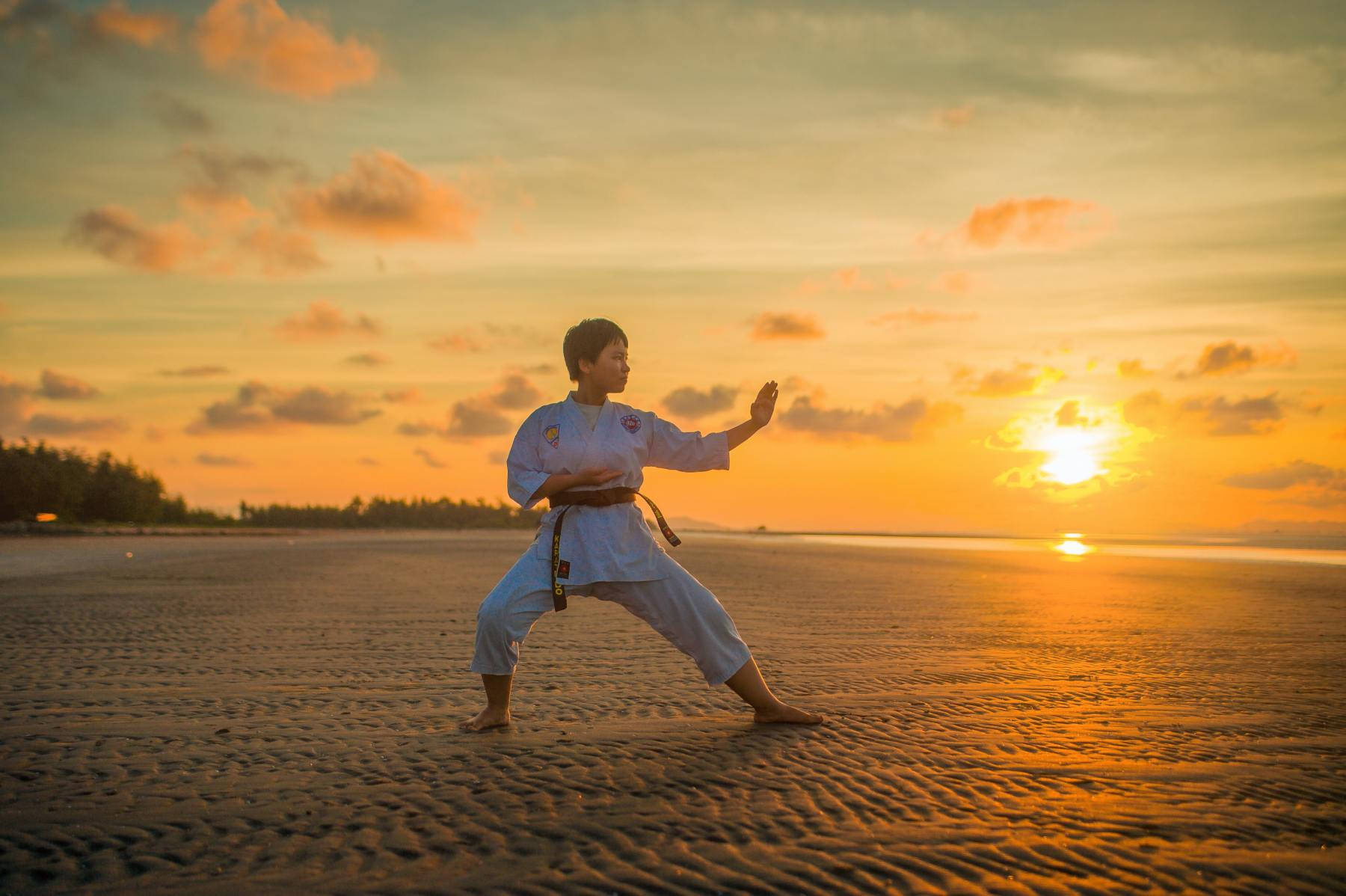 Serene Tai Chi Practice At Sunset. Wallpaper