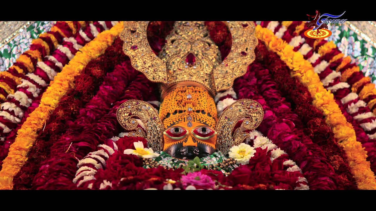 Shyam Baba With Red And Yellow Garlands Wallpaper