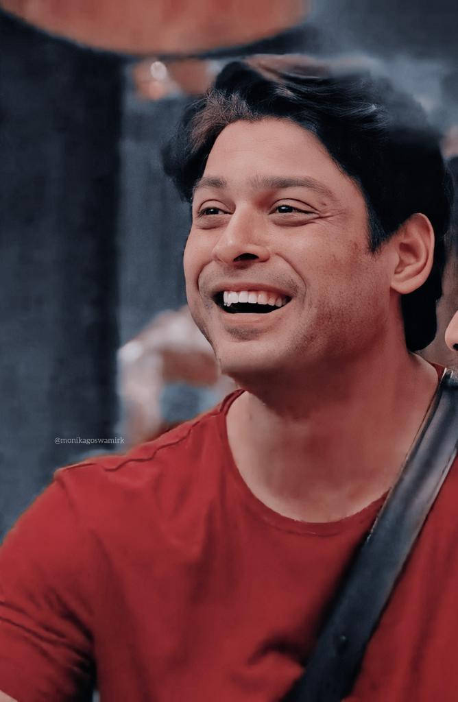 Smiling Sidharth Shukla In Red Shirt Wallpaper