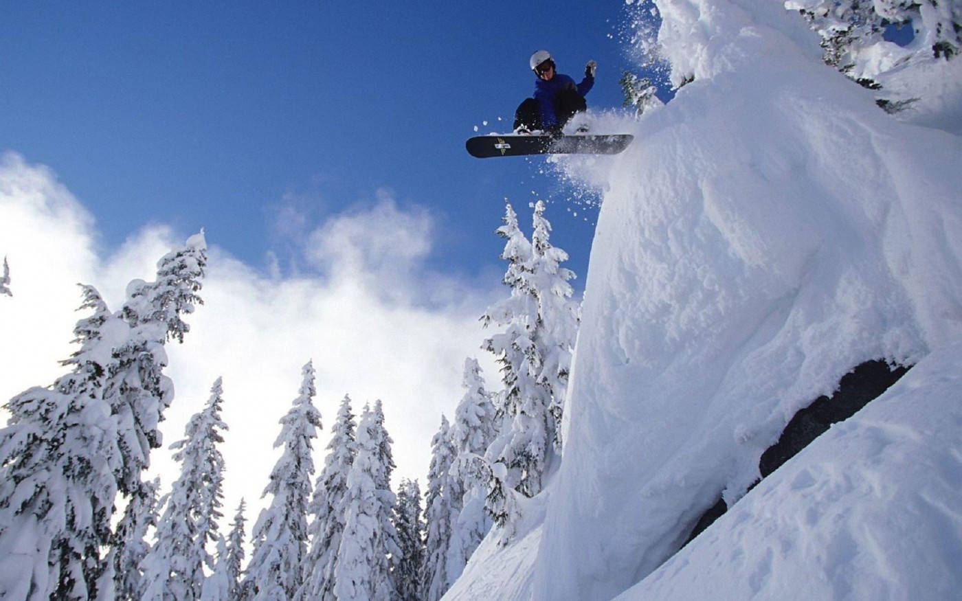 Snowboard Coming Down From High Ledge Wallpaper