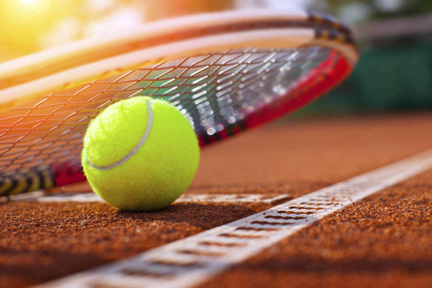 Squash Ball Under A Racket Wallpaper