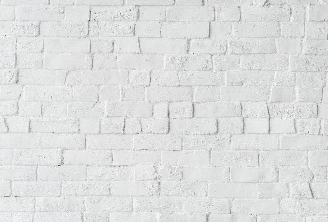 Stand Out From The Crowd With A Lopsided White Brick Wallpaper