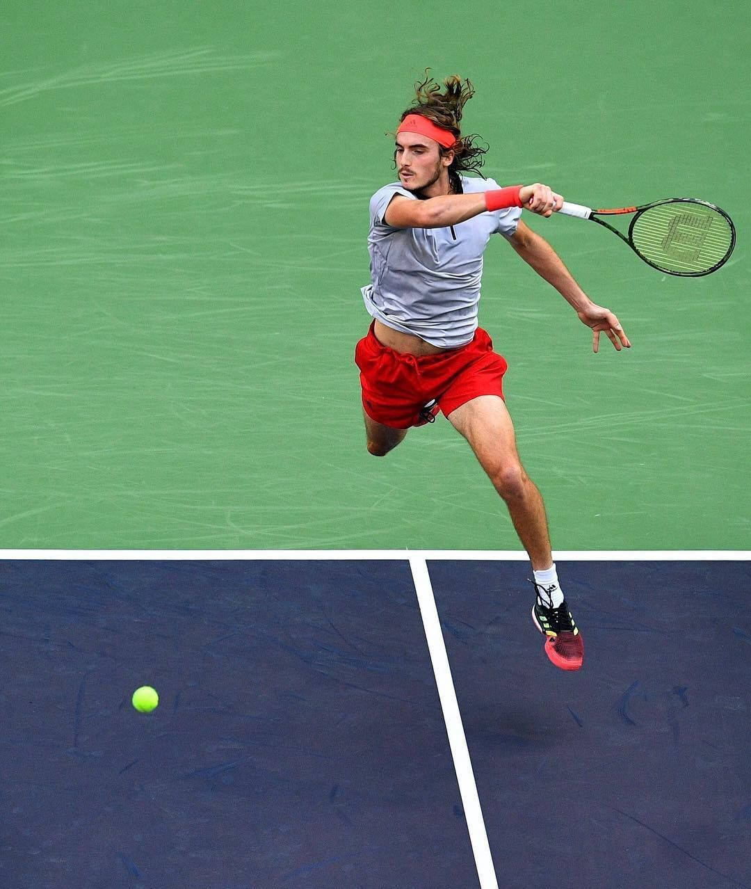 Stefanos Tsitsipas Jumping Midair Wallpaper