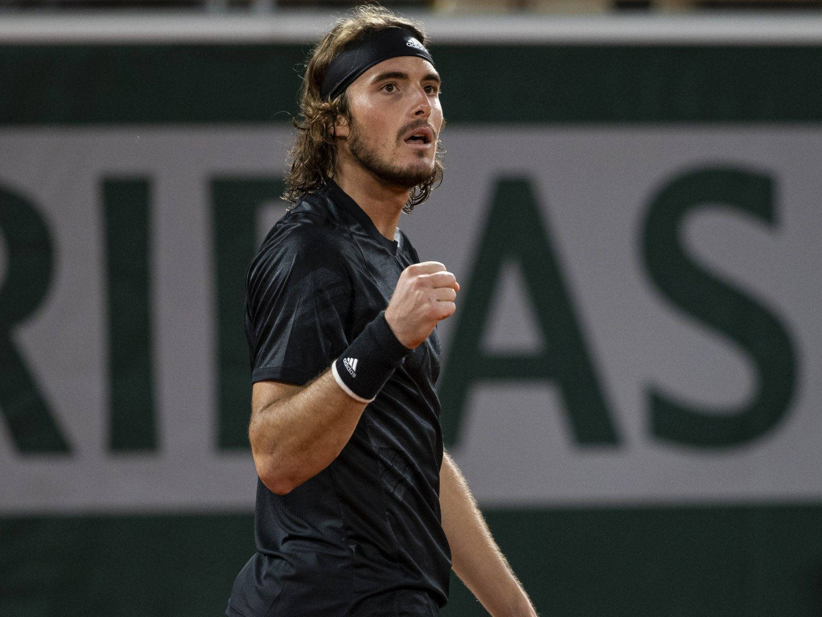 Stefanos Tsitsipas Looking Up Wallpaper