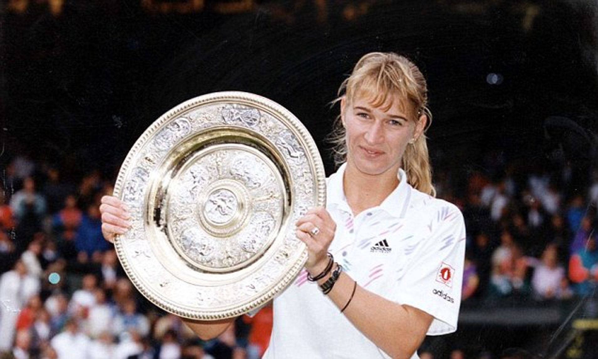 Steffi Graf Triumphantly Holding The Wimbledon Trophy Wallpaper