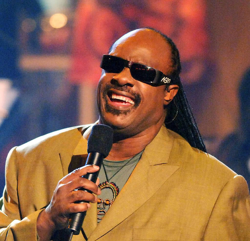 Stevie Wonder Holding Microphone Wallpaper