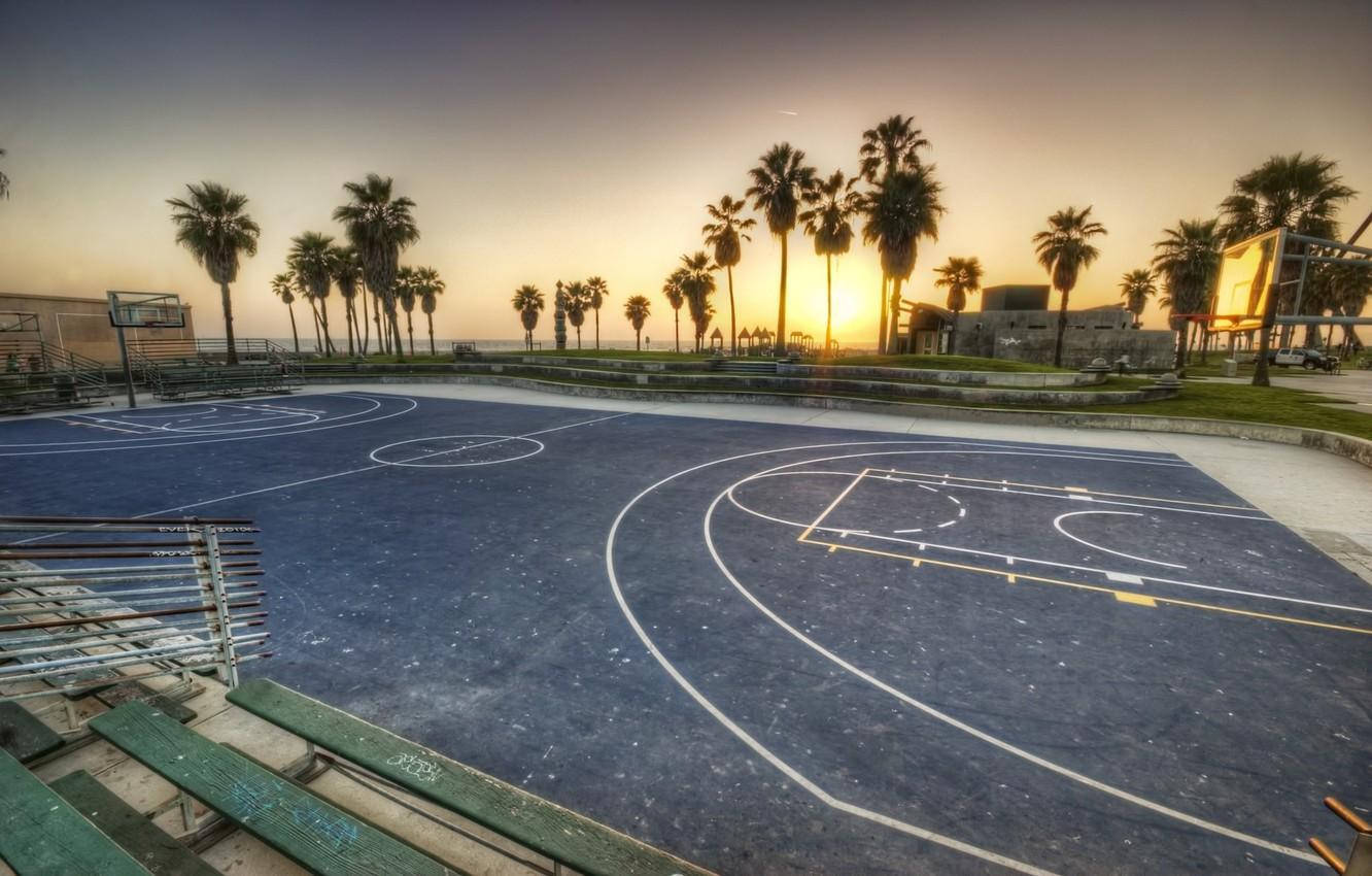 Sunset Over An Empty Basketball Court At Venice Beach Wallpaper