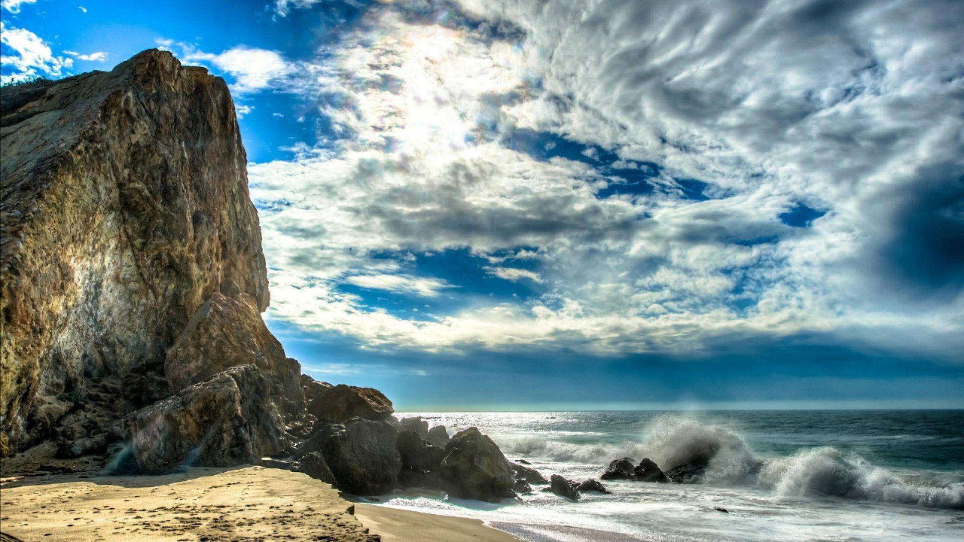 Tall Cliff On Malibu Beach Wallpaper