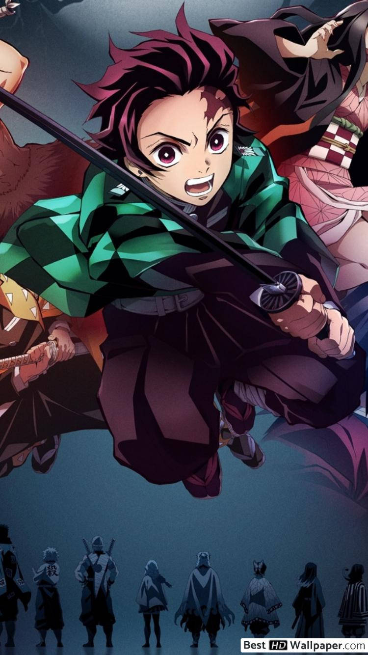 Tanjiro Bravely Faces Off Against A Demon Wallpaper