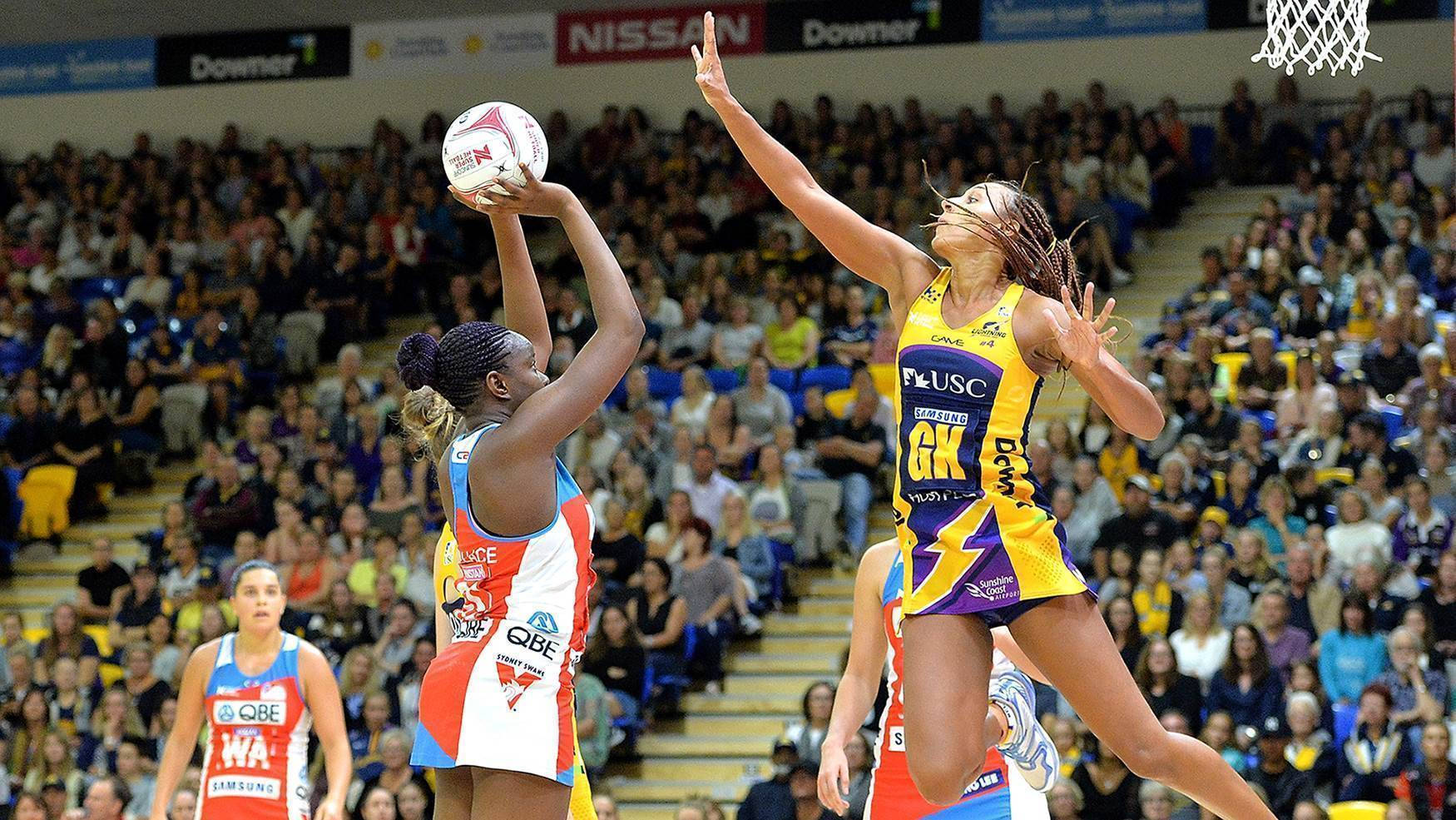 Teenage Girls Shoot Block Playing Netball Wallpaper