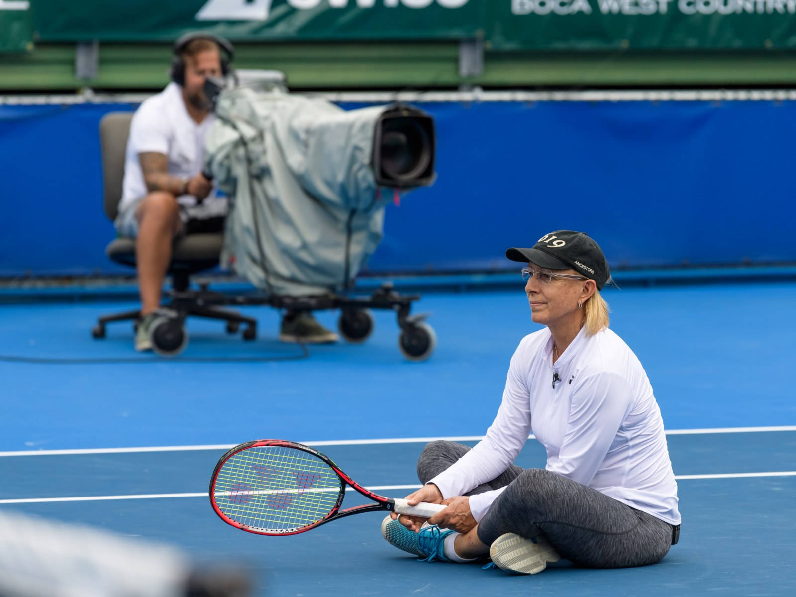 Tennis Icon Martina Navratilova Resting On Court Wallpaper