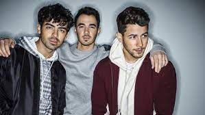 The Jonas Brothers Rocking The Stage Wallpaper