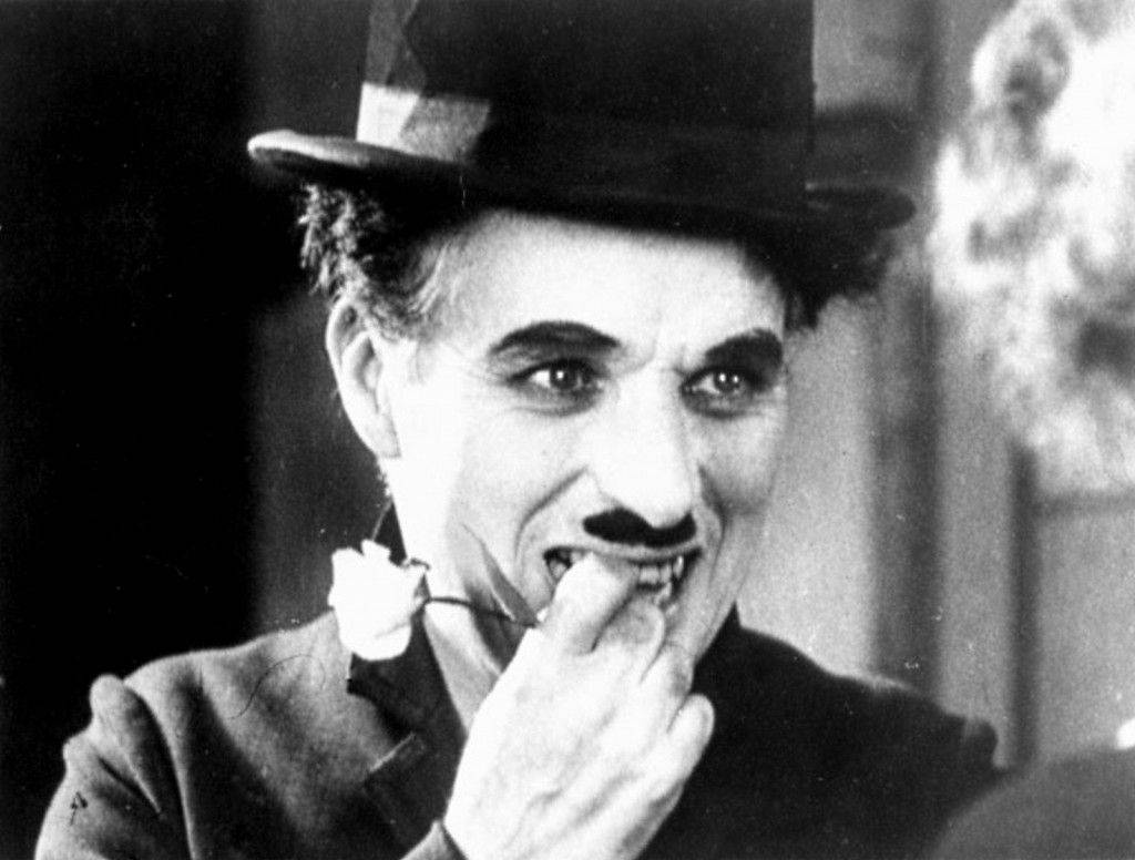 The Legendary Actor Charlie Chaplin Cracks A Nervous Smile Wallpaper