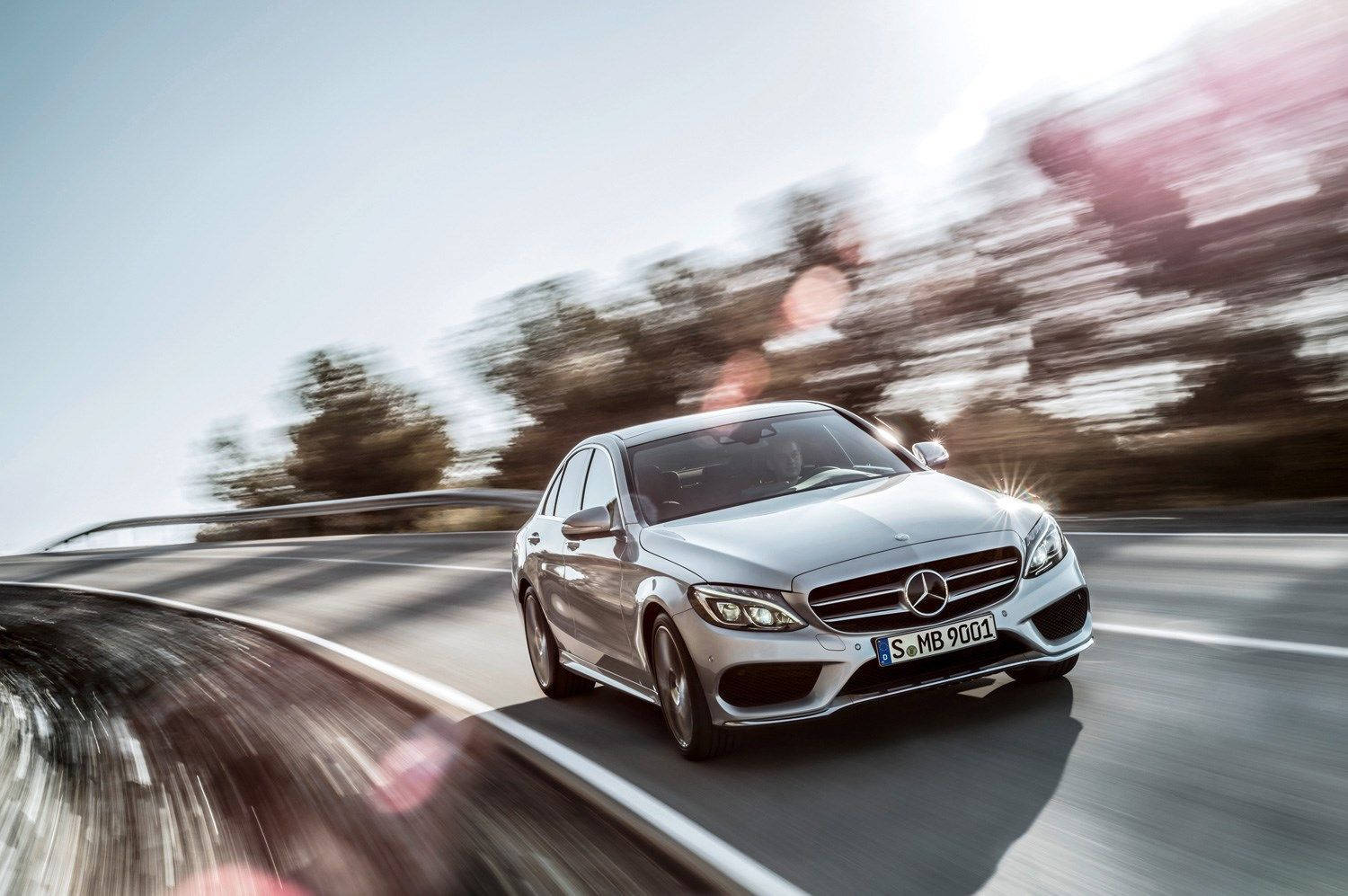 The Luxurious Mercedes Benz C300 On A Serene Coast Road Wallpaper