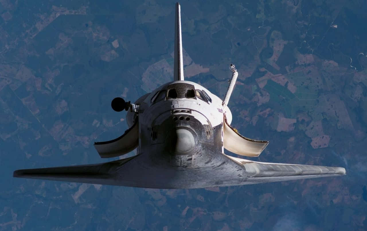 The Space Shuttle In Earth's Orbit Wallpaper