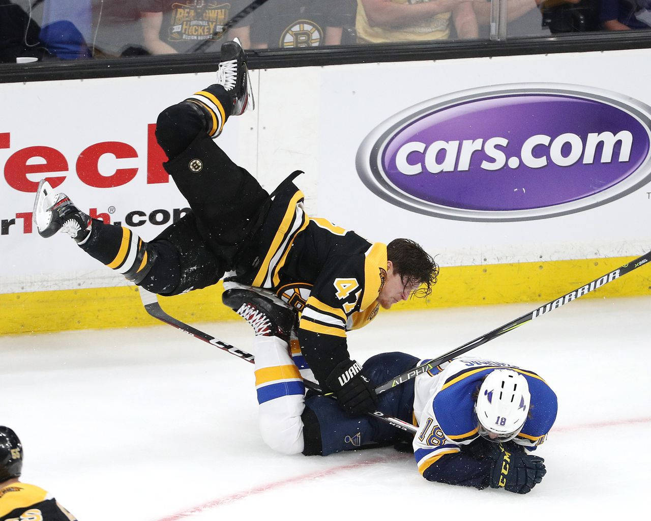 Torey Krug In Action During A Hockey Game Against Robert Thomas Wallpaper