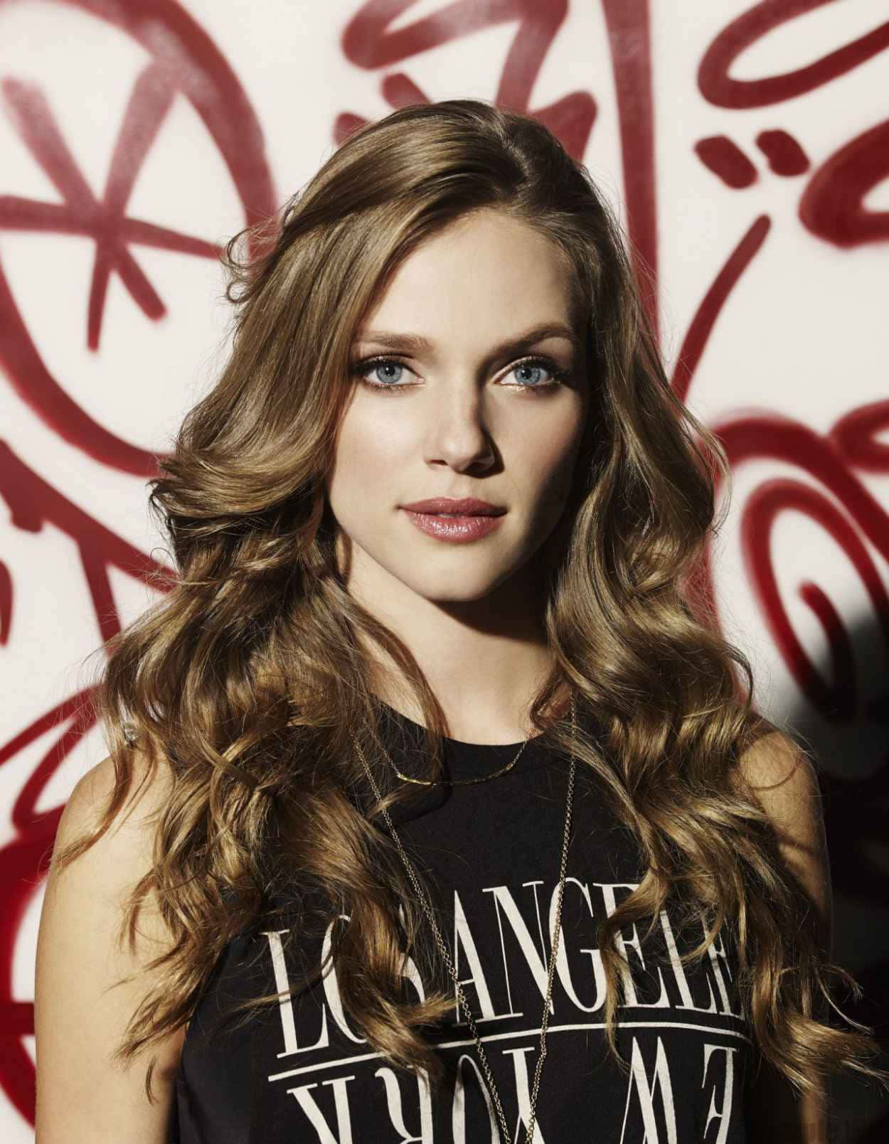 Tracy Spiridakos Portraitwith Graffiti Background Wallpaper