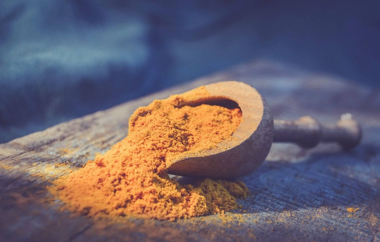 Turmeric Powder Scoop Wallpaper