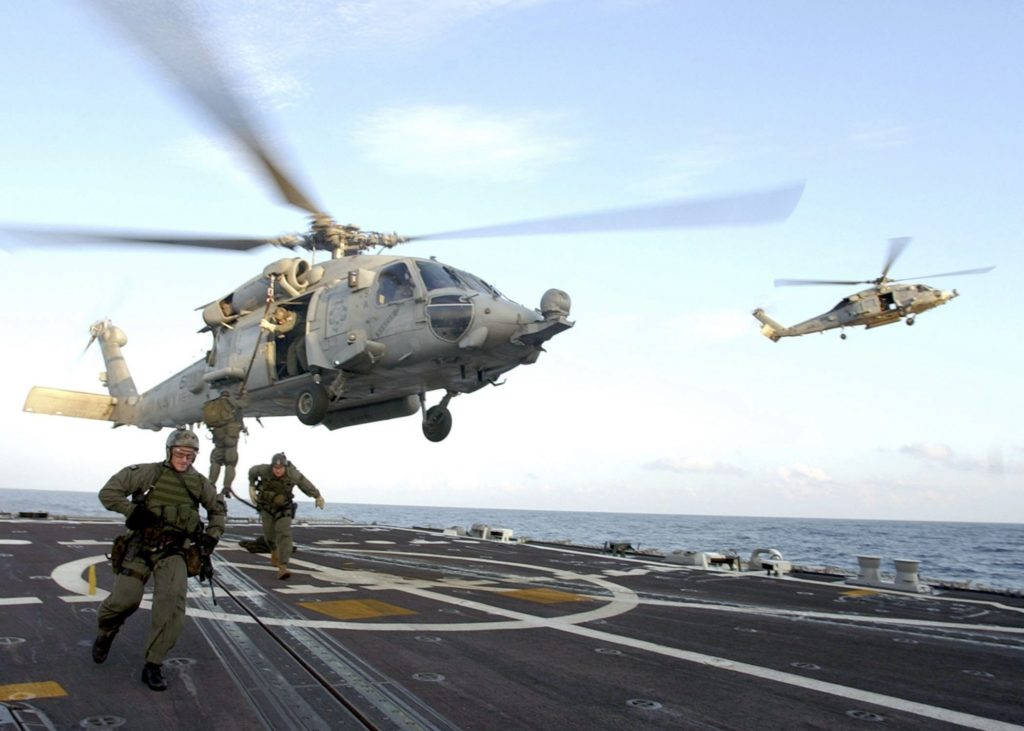 U S Navy Helicopter Landing On A Carrier Wallpaper
