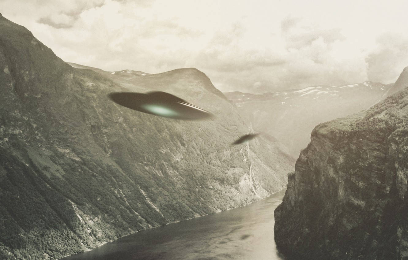 Ufos Racing Through Valley Wallpaper