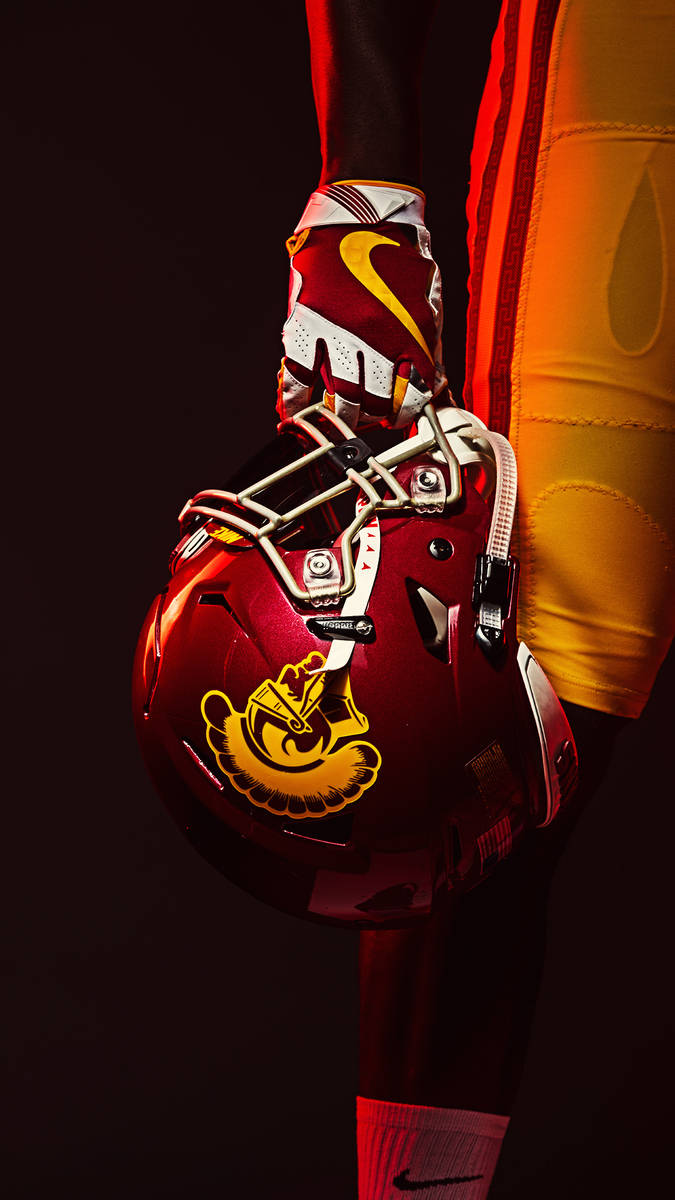 Usc Football Player Holding Helmet Wallpaper