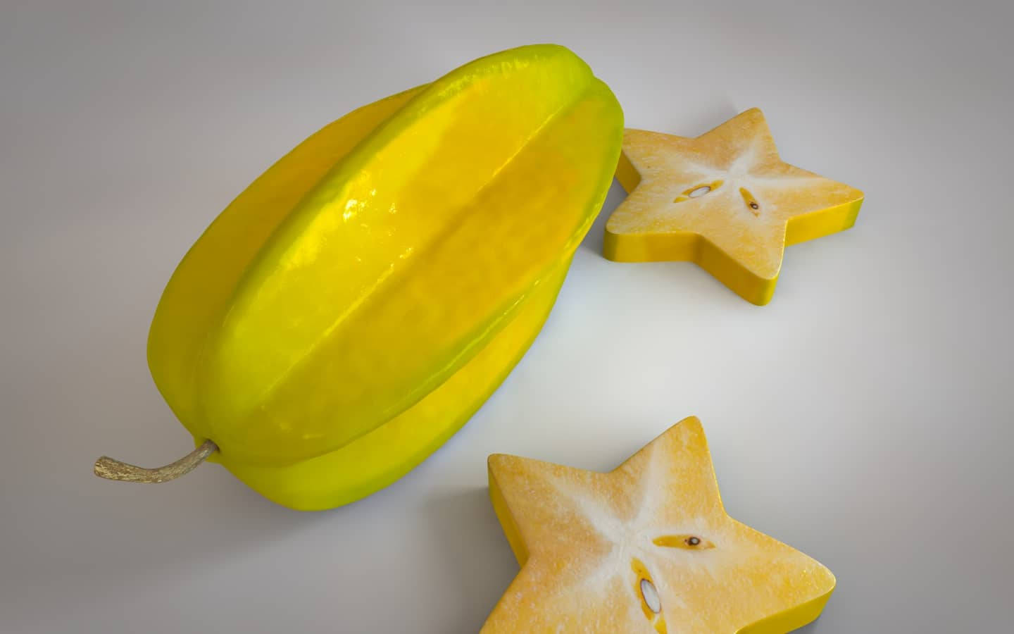 Vibrant Image Of Two Slices Of Star Fruit Wallpaper