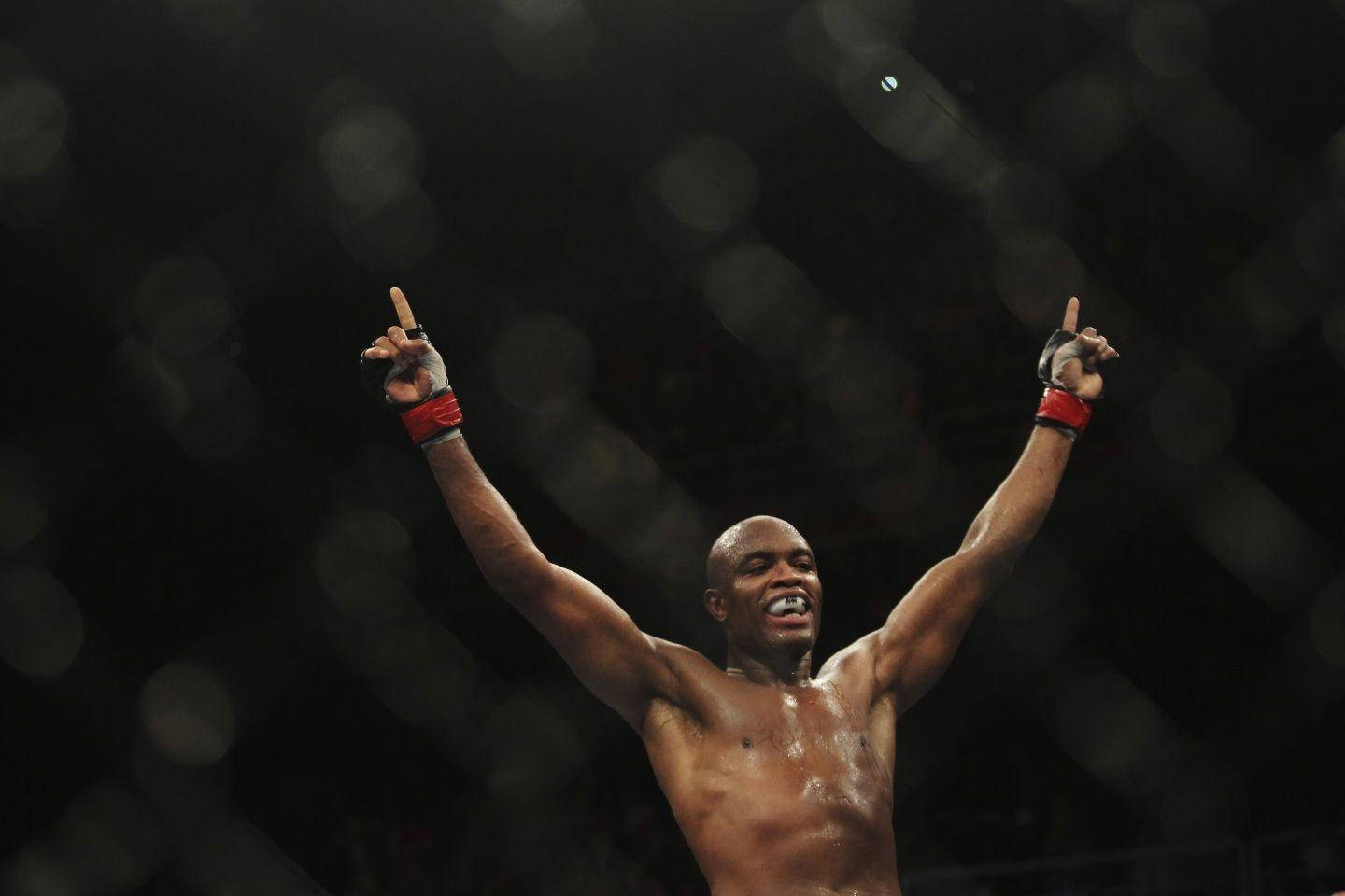 Victorious Look Of Anderson Silva Pointing Upwards Wallpaper