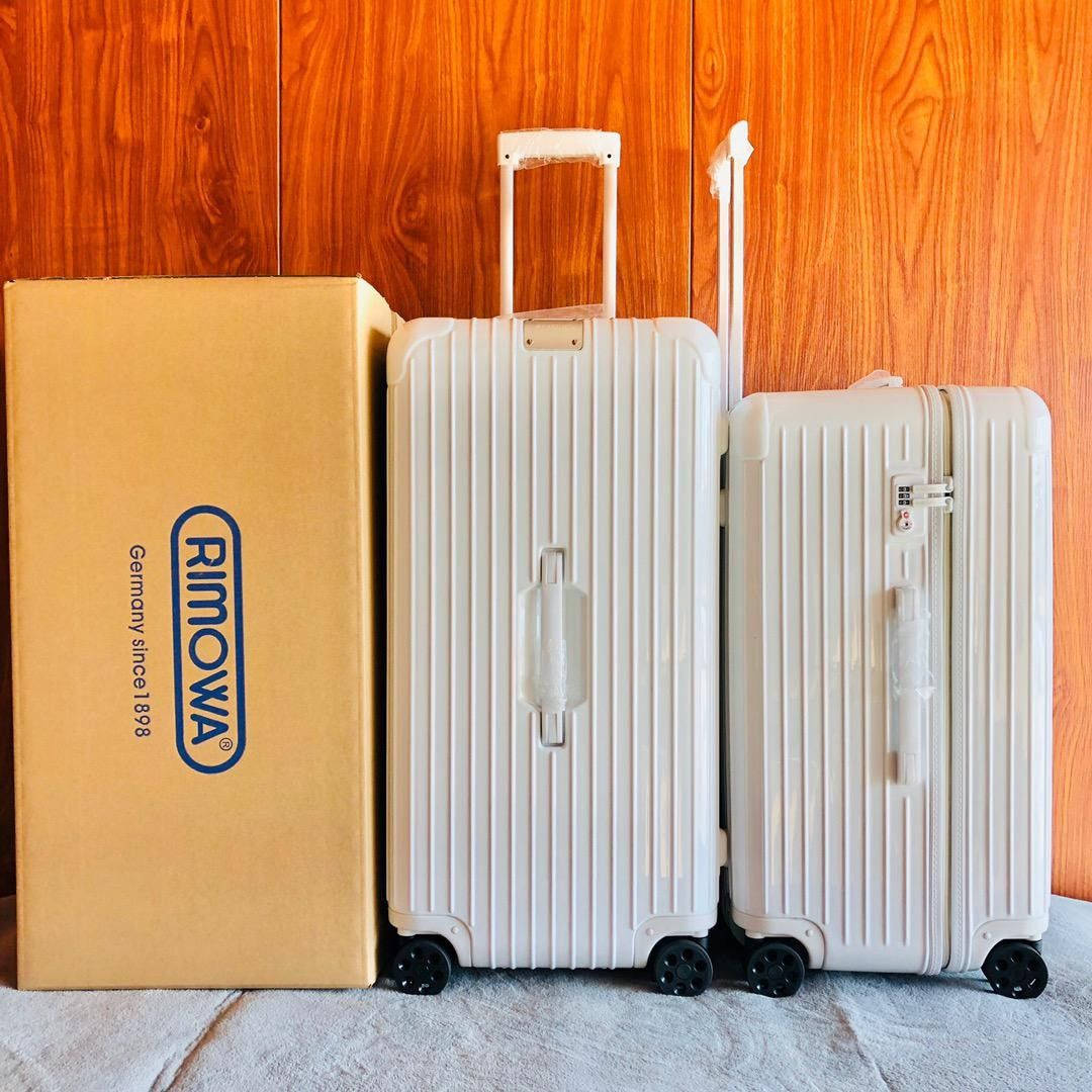 White Rimowa Suitcases Wallpaper