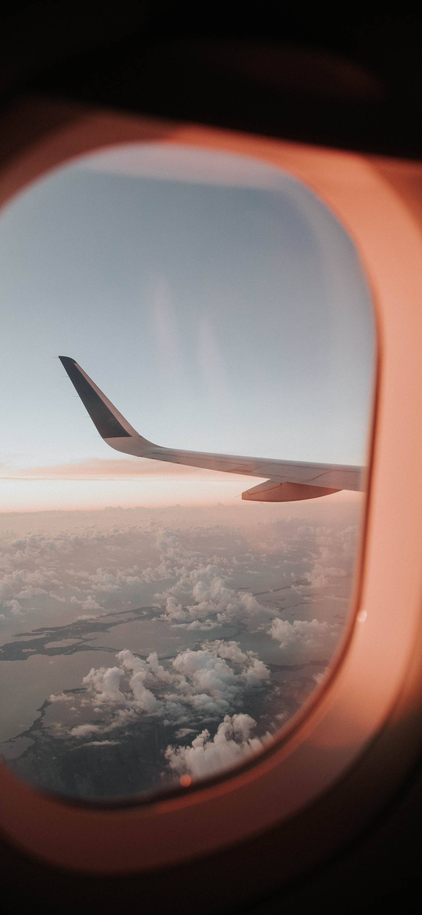 Window View Of A Flying Airplane Android Wallpaper