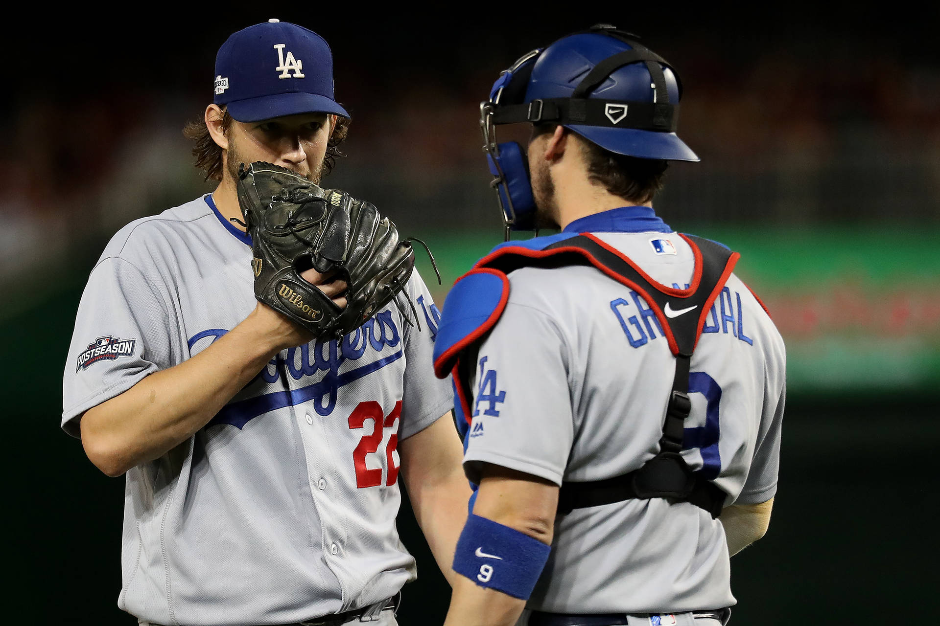 Yasmani Grandal Talking With Pitcher Wallpaper